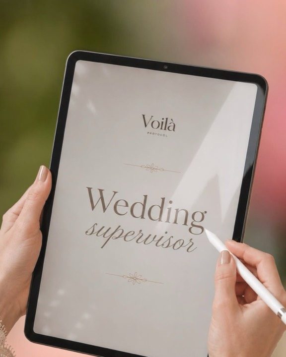 A hand writing on a Voil&agrave; Protocol document on a tablet