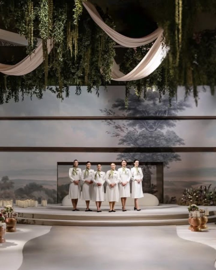 The Voil&agrave; Protocol team before a painted mural, ahead of the guests